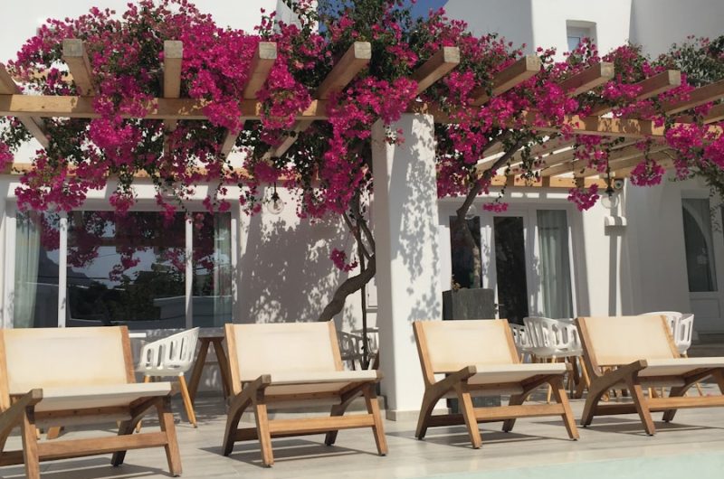 three deck chairs beside outdoor pool